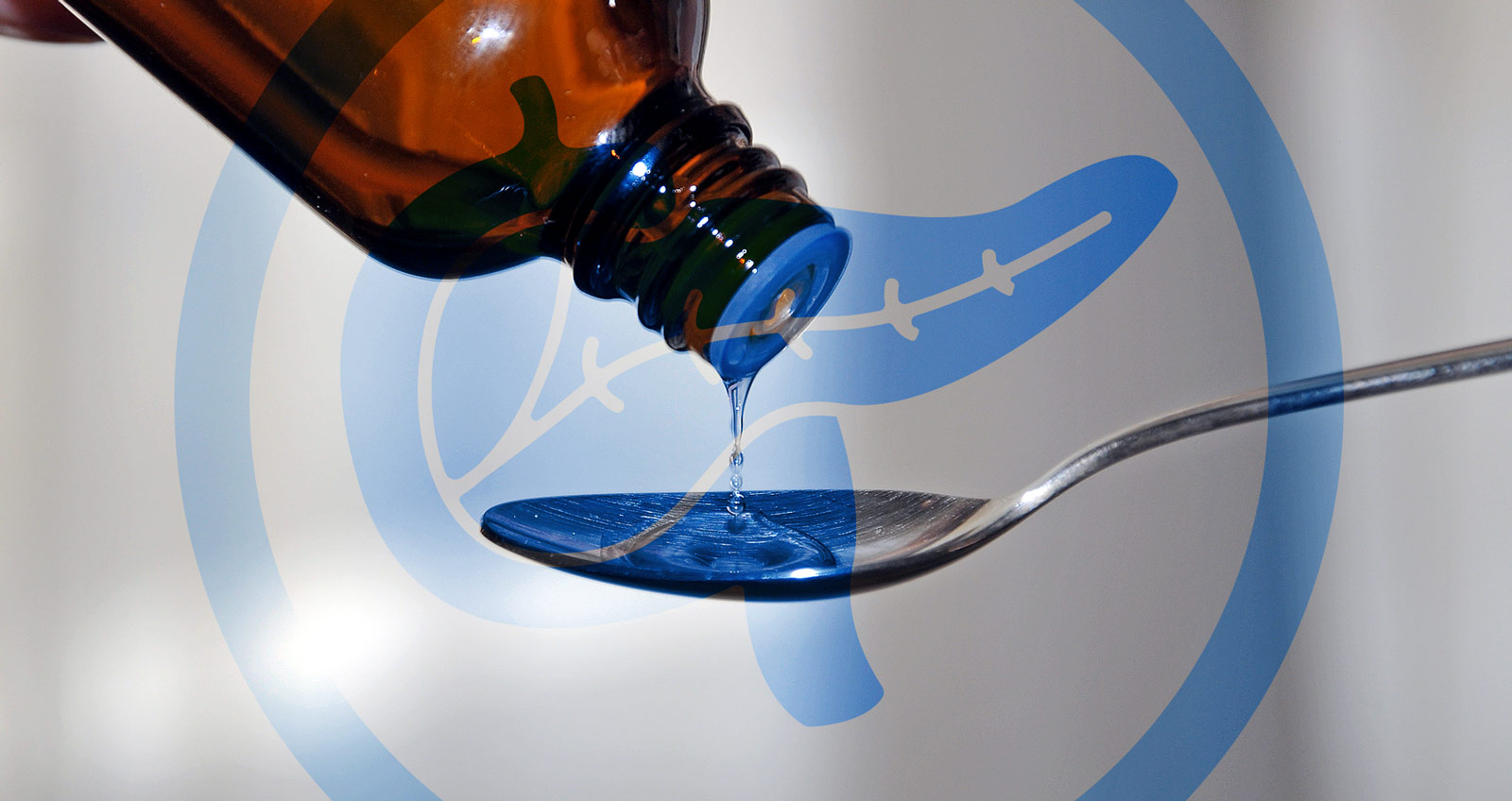 Hustenstiller Hustensaft wird auf einen Löffel geträufelt. Davor eine Bauchspeicheldrüse in einem Schutzkreis.