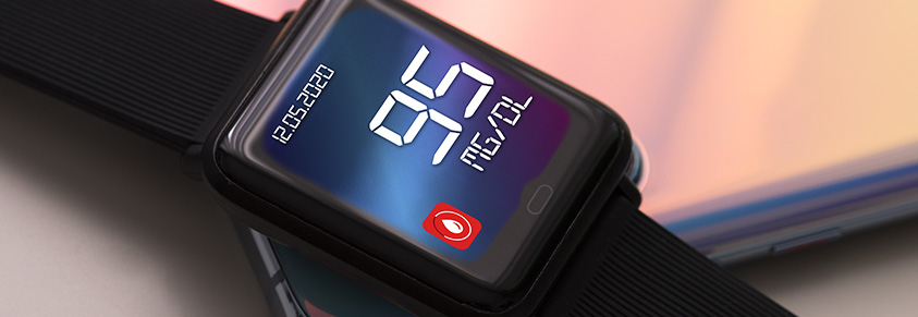 Eine Smartwatch, die einen Blutzuckerwert anzeigt